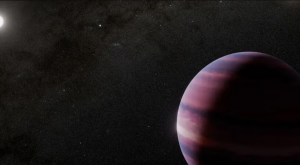 artist's impression of the binary system, with a Saturn-sized planet orbiting the primary star